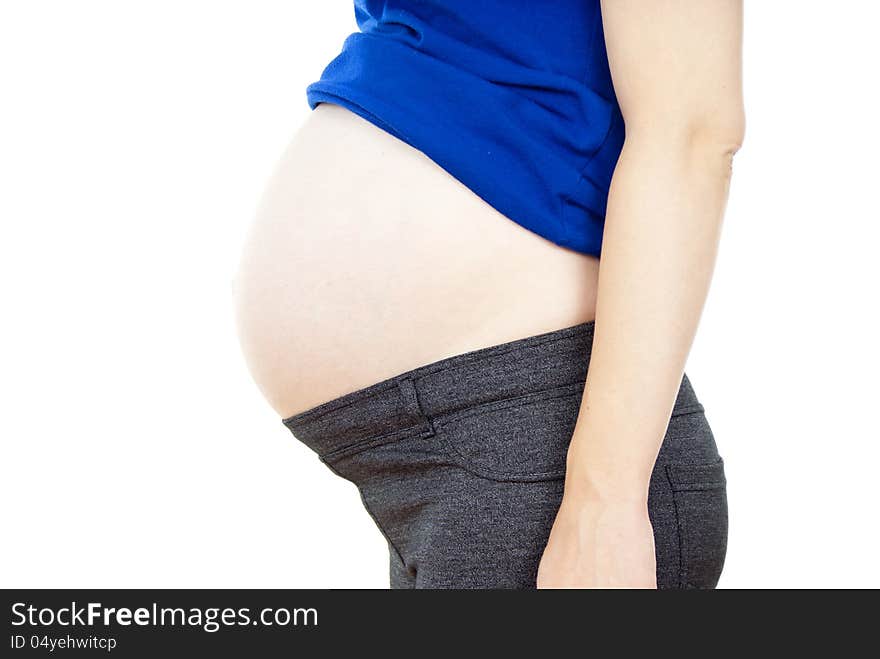 Detail of the abdomen of pregnant woman isolated on white background