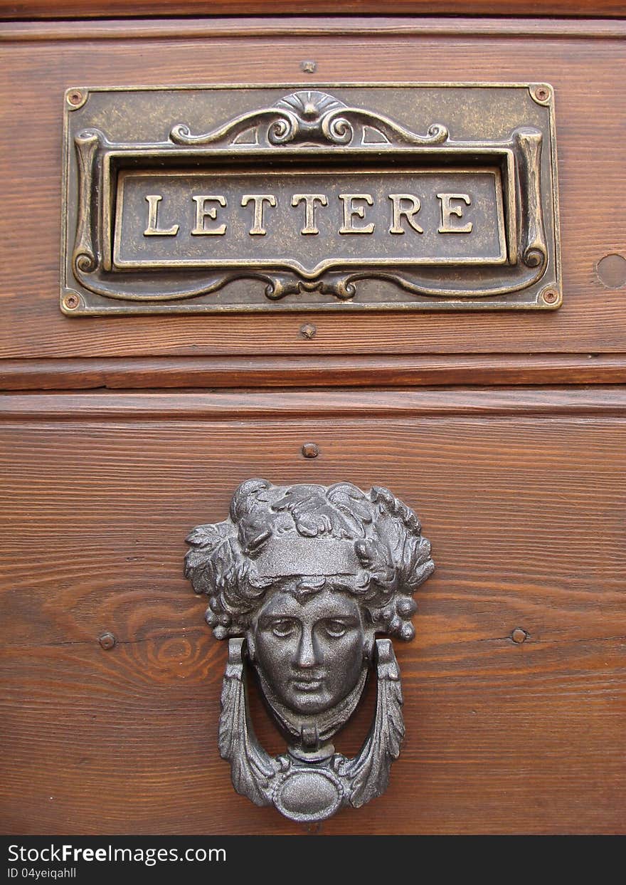 Wooden door with metal ornaments