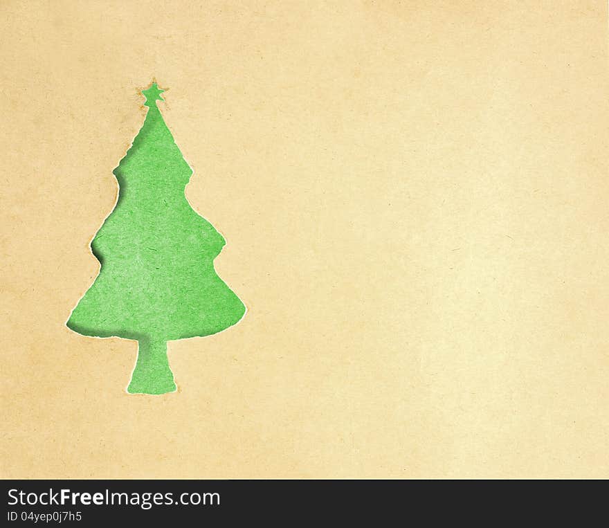 Torn paper christmas tree on green background. Torn paper christmas tree on green background