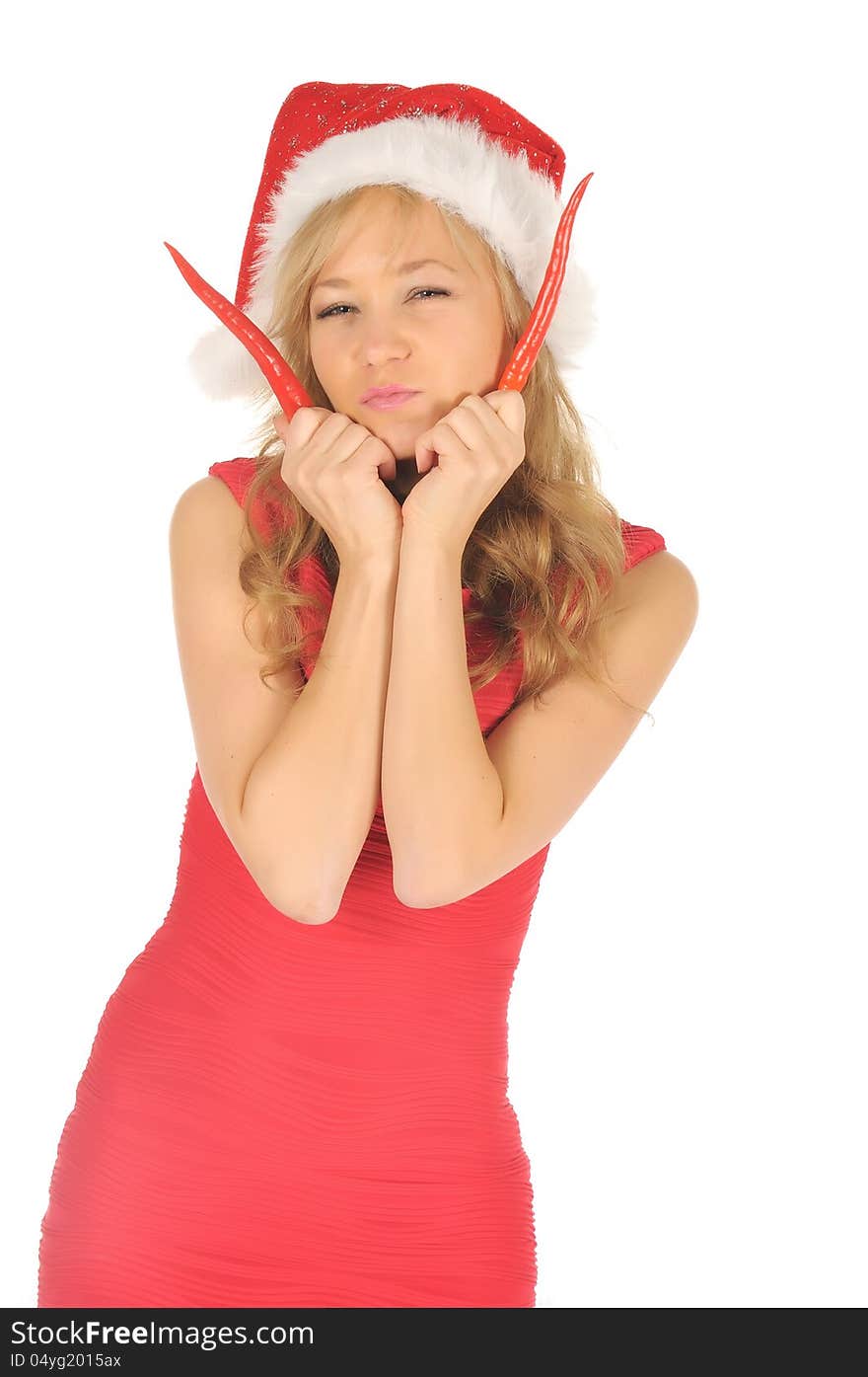 Attractive young woman in Santa Cap with chili pepper. isolated on white. Attractive young woman in Santa Cap with chili pepper. isolated on white.