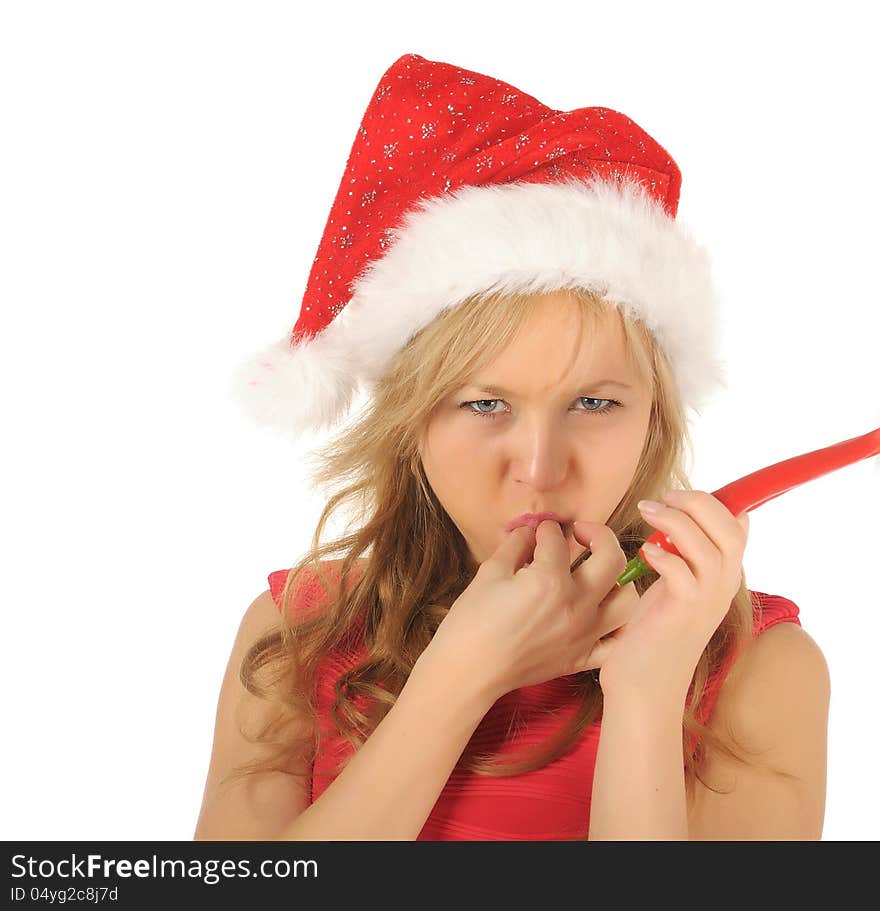 Attractive young woman in Santa Cap with chili pepper. isolated on white. Attractive young woman in Santa Cap with chili pepper. isolated on white.