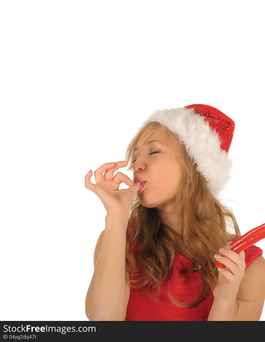 Attractive woman in Santa Cap with chili pepper