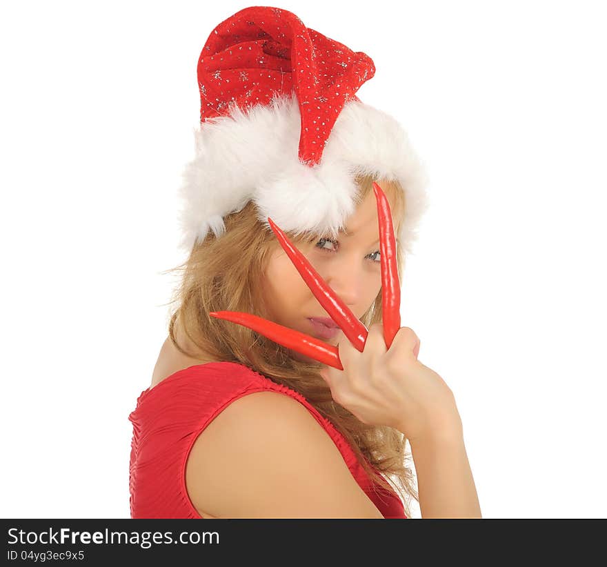 Attractive young woman in Santa Cap with chili pepper. isolated on white. Attractive young woman in Santa Cap with chili pepper. isolated on white.