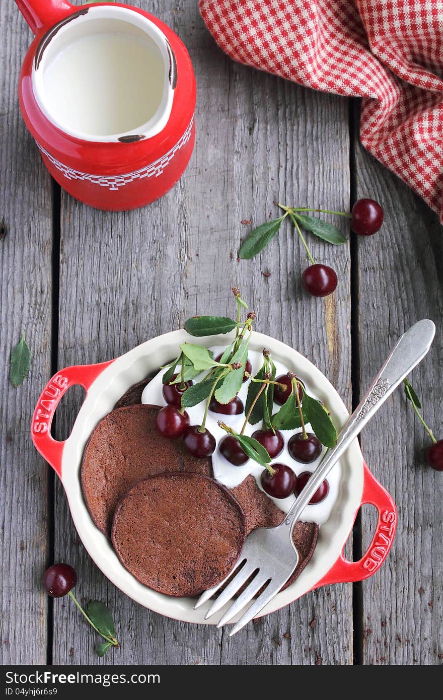 Chocolate Pancakes with Vanilla Cream and Cherries