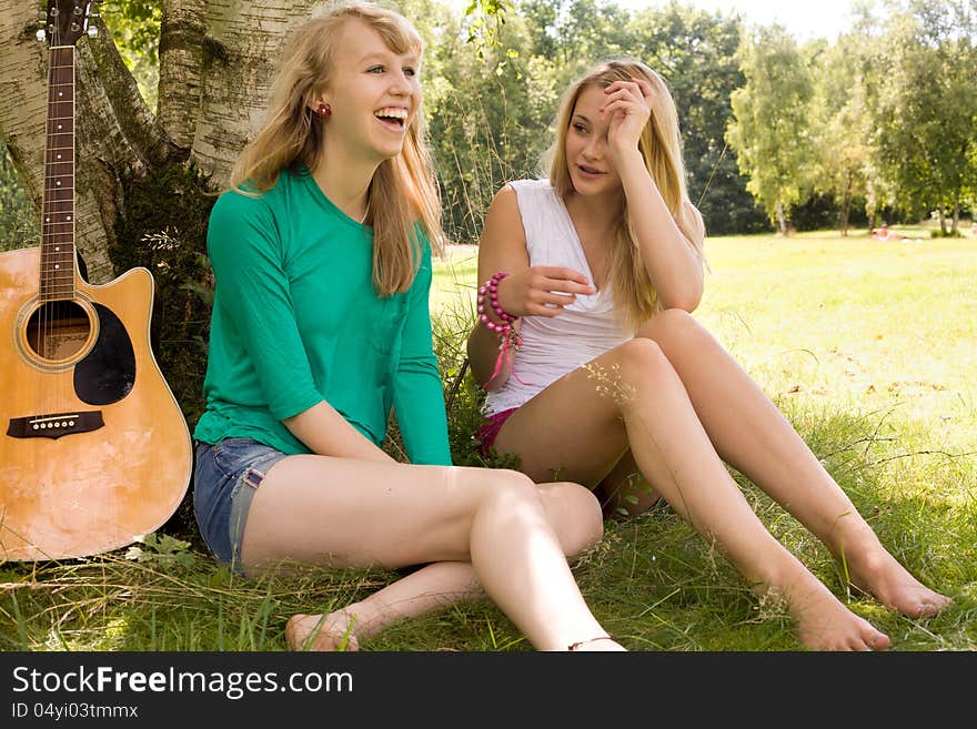 Two girls are having fun in the summer sun. Two girls are having fun in the summer sun