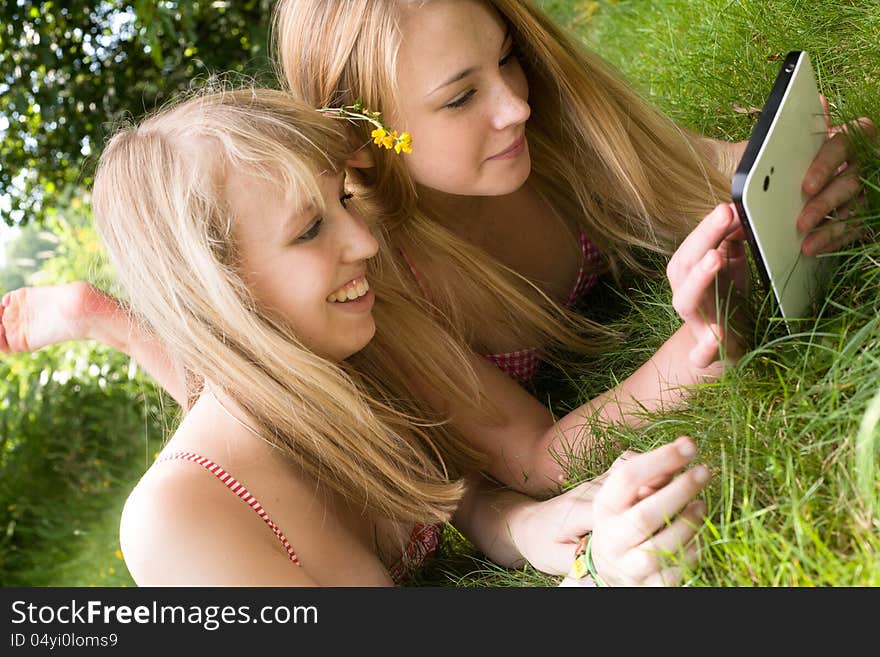 Two girls are having fun in the summer sun. Two girls are having fun in the summer sun