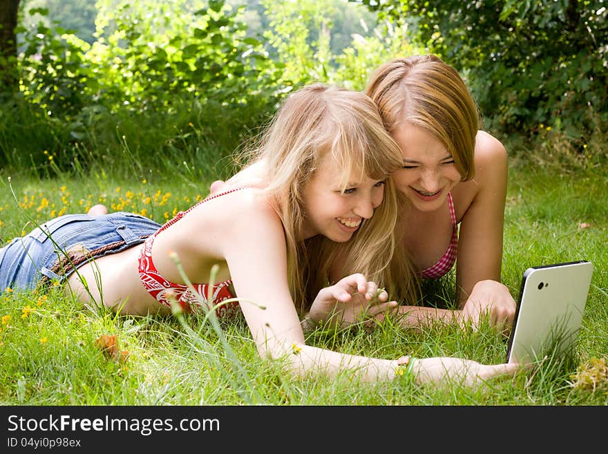 Two girls are having fun in the summer sun. Two girls are having fun in the summer sun