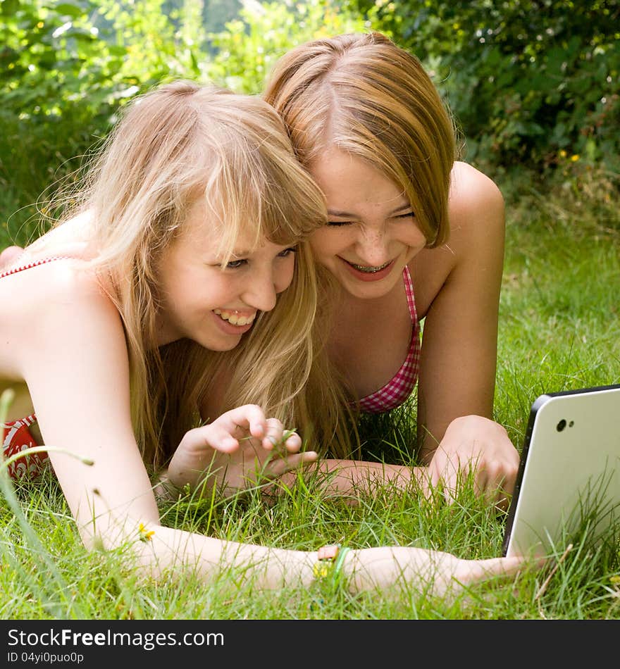 Two girls are having fun in the summer sun. Two girls are having fun in the summer sun