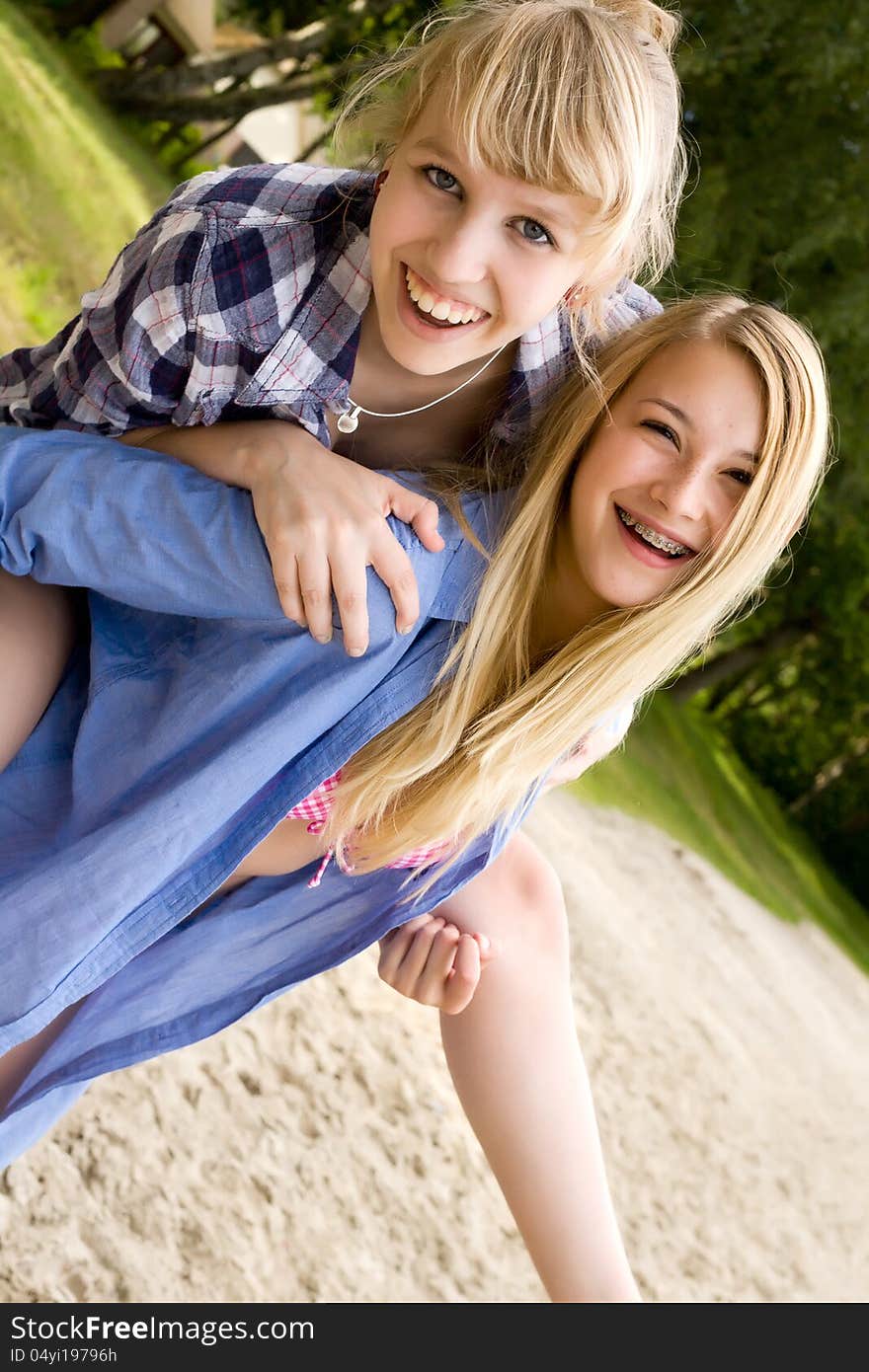 Two girls are having fun in the summer sun. Two girls are having fun in the summer sun