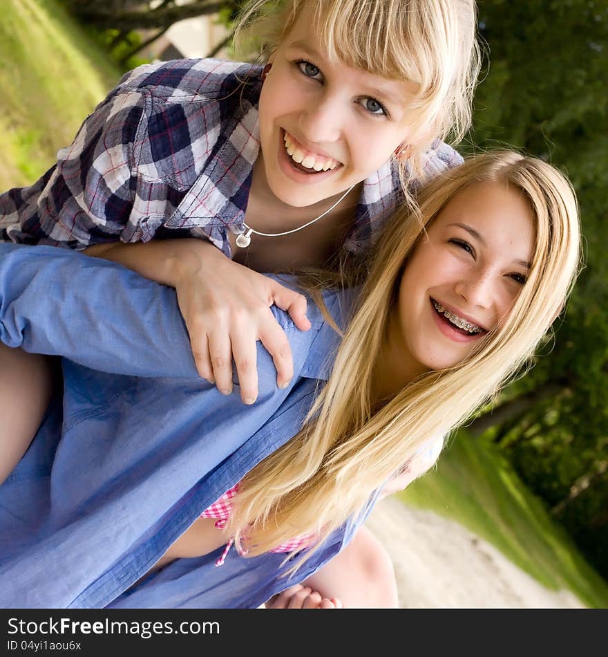 Two girls are having fun in the summer sun. Two girls are having fun in the summer sun