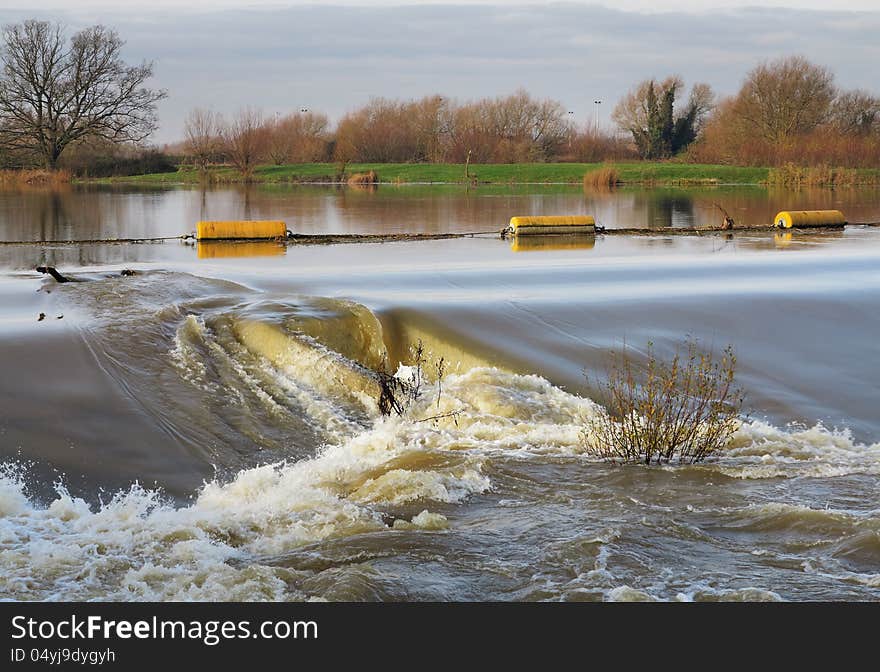 Flood Water Passing Over A Weir