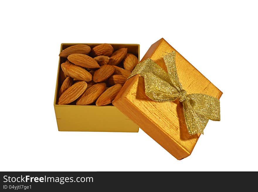 The gold bow with bow and almond inside isolated. The gold bow with bow and almond inside isolated
