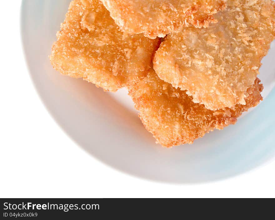 Fish sticks in dish on a white background