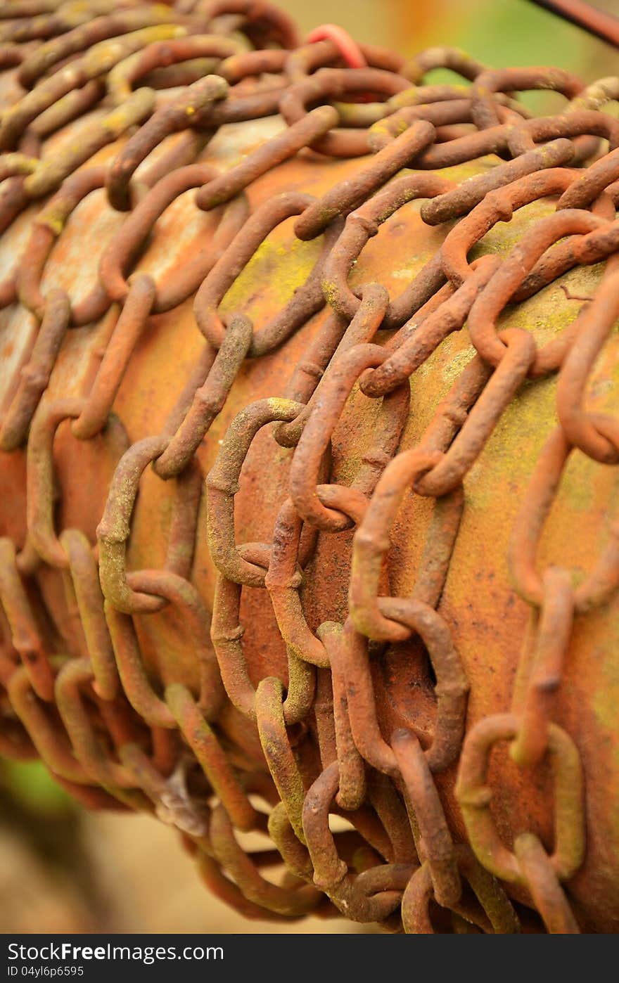 Photo of an old and rusty fountain chain. Photo of an old and rusty fountain chain