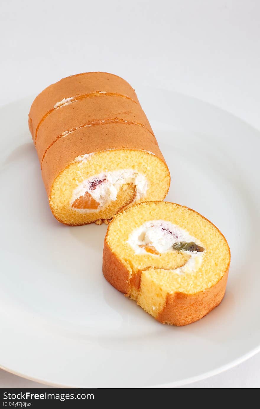 Roll cake on white background