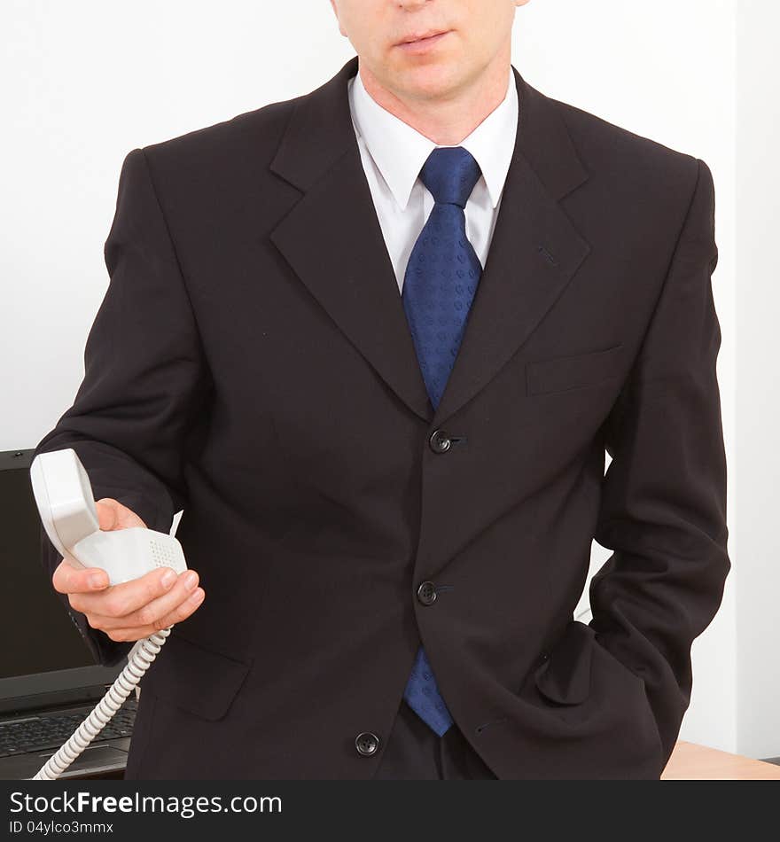 Businessman calling on the phone. Close-up on a white background.