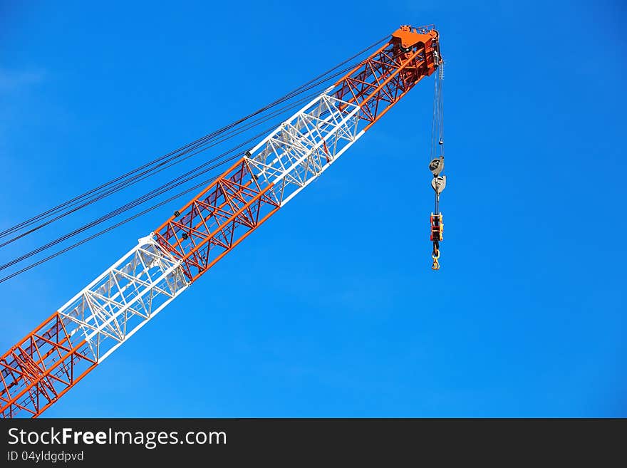 Crane in construction area and blue sky