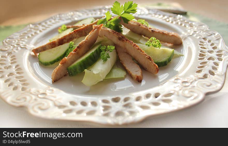 Fresh salad with grilled meat stripes