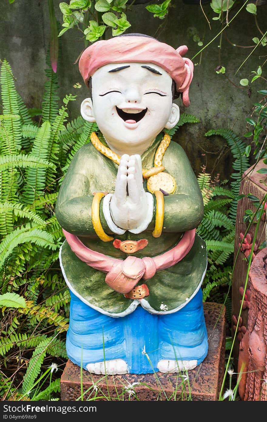 Child sculpture in garden, Phuket, Thailand