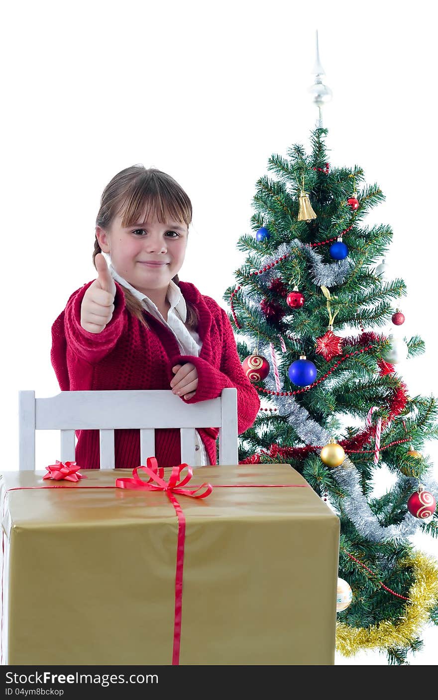 Happy girl with thumb up in Christmas time scenery. Happy girl with thumb up in Christmas time scenery