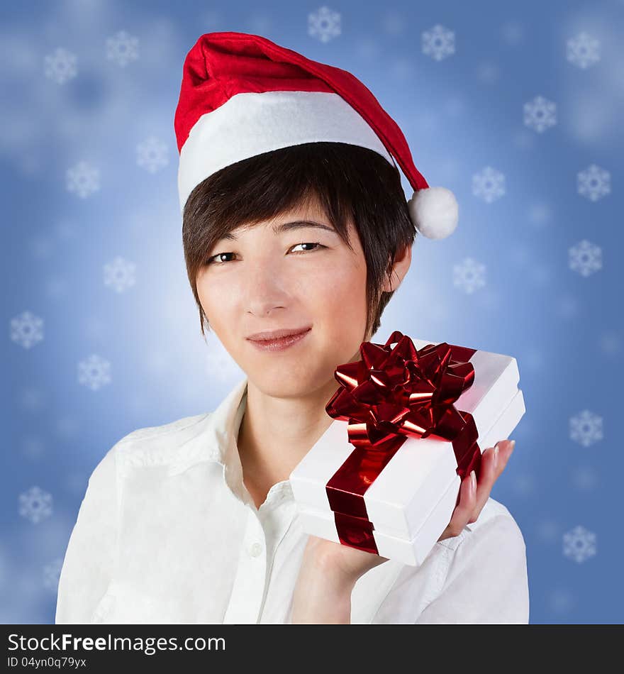 Woman In Santa Hat With Gift Box