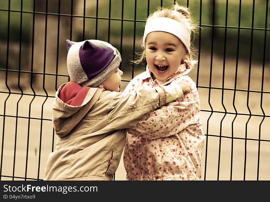 Portrait of two little kids. Hugs and smile. Portrait of two little kids. Hugs and smile.