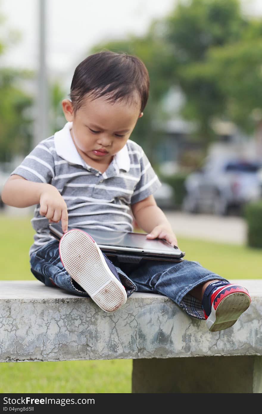 Little boy using a tablet computer