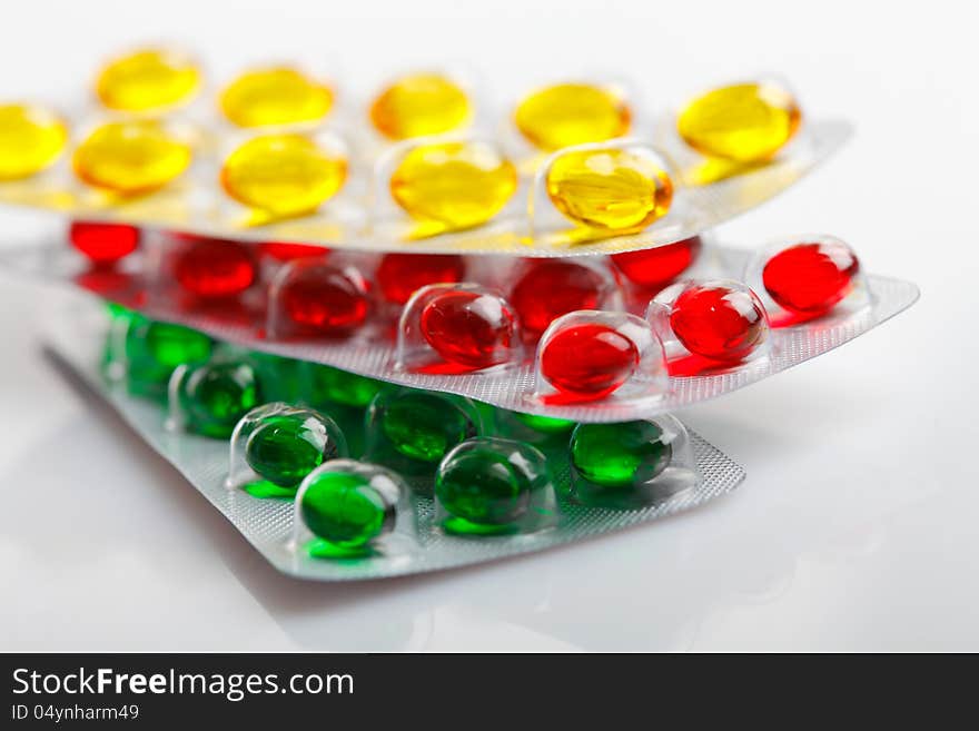 Capsules and pills packed in blisters, close up. Capsules and pills packed in blisters, close up