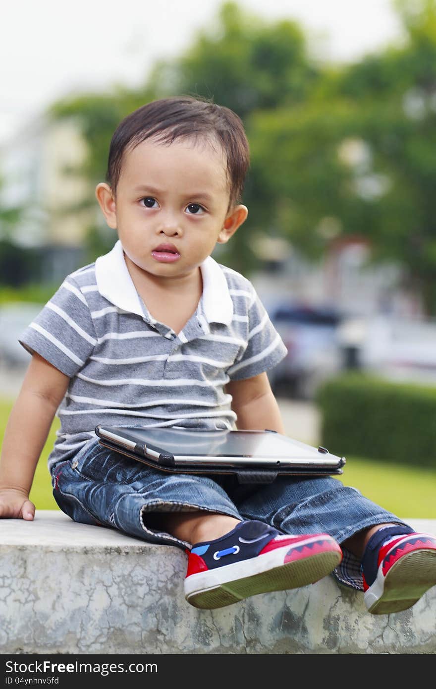 Little boy with his a tablet