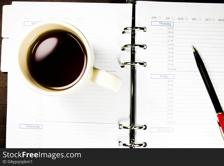 A cup of tea on notebook. A cup of tea on notebook