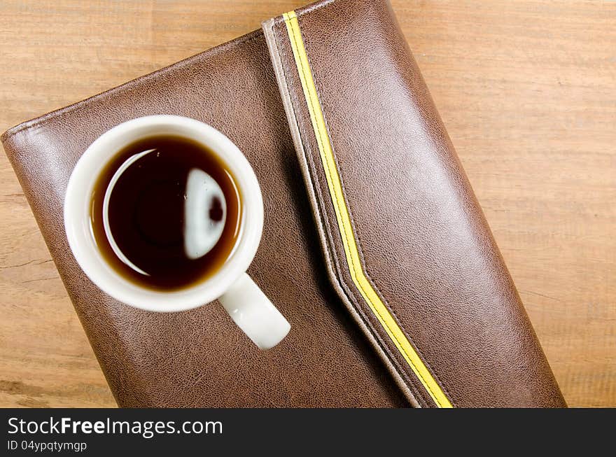 A cup of tea on notebook. A cup of tea on notebook