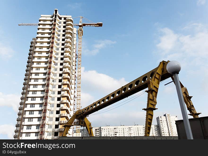 Building a new home in the city center during the day. Building a new home in the city center during the day