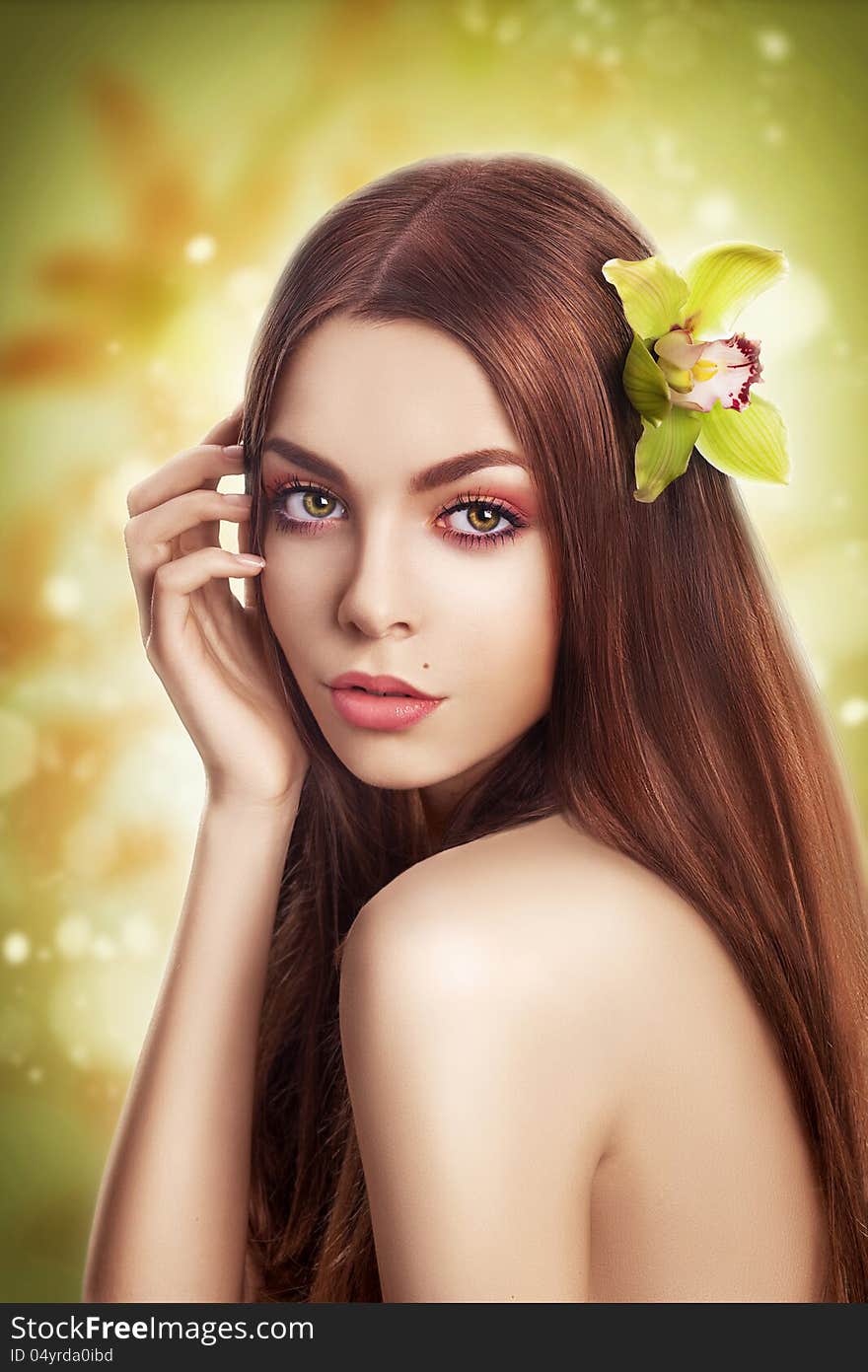 Beautiful brunette Model with Healthy Straight Hair with Flower. Beautiful brunette Model with Healthy Straight Hair with Flower