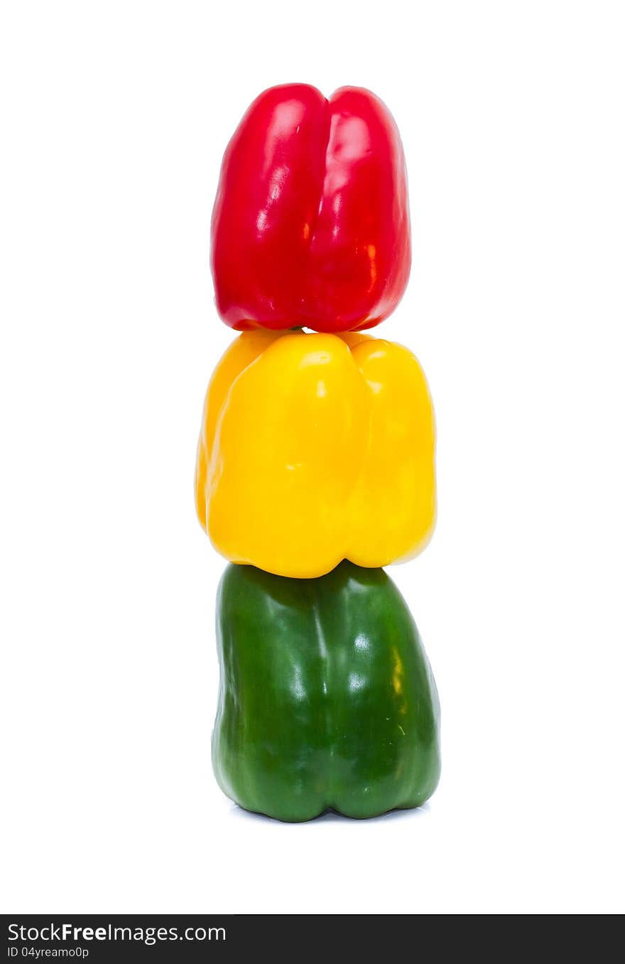 Three colored peppers  on white background