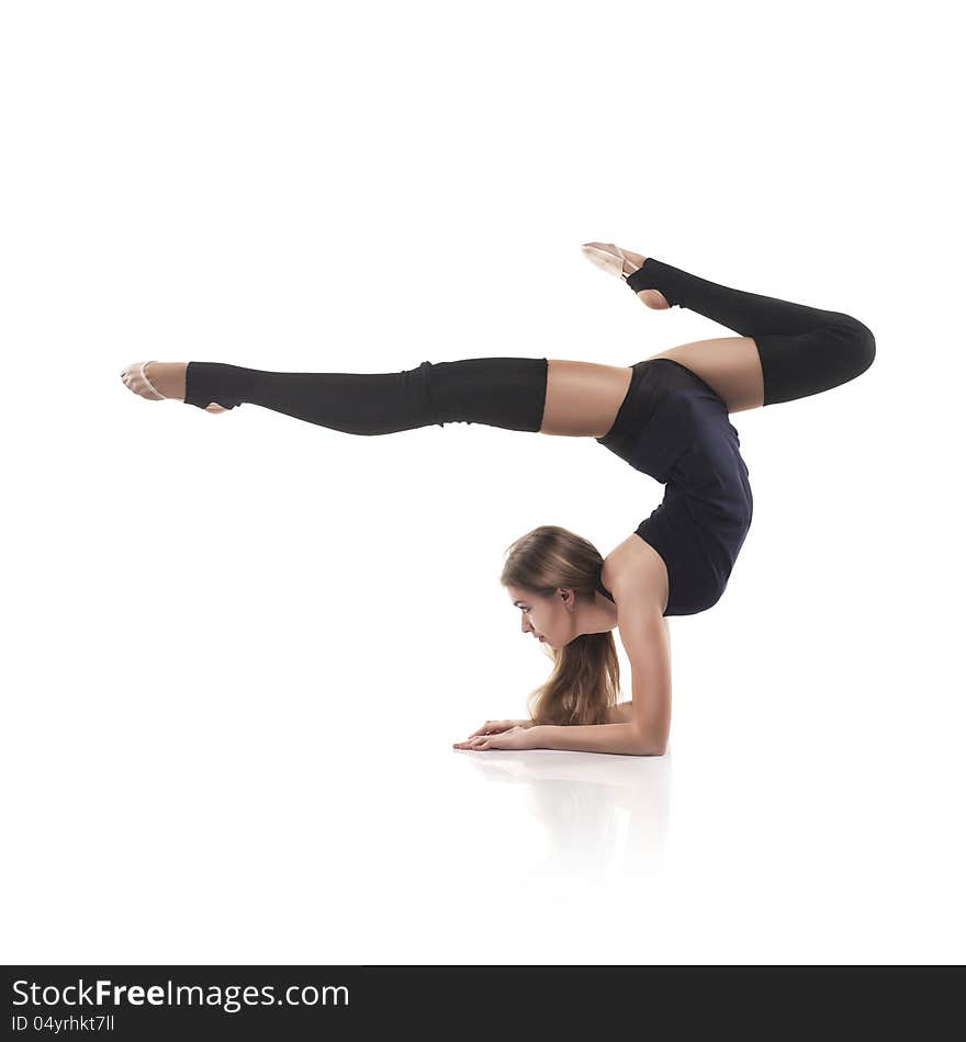 Studio shoot of cute woman gymnast on white background