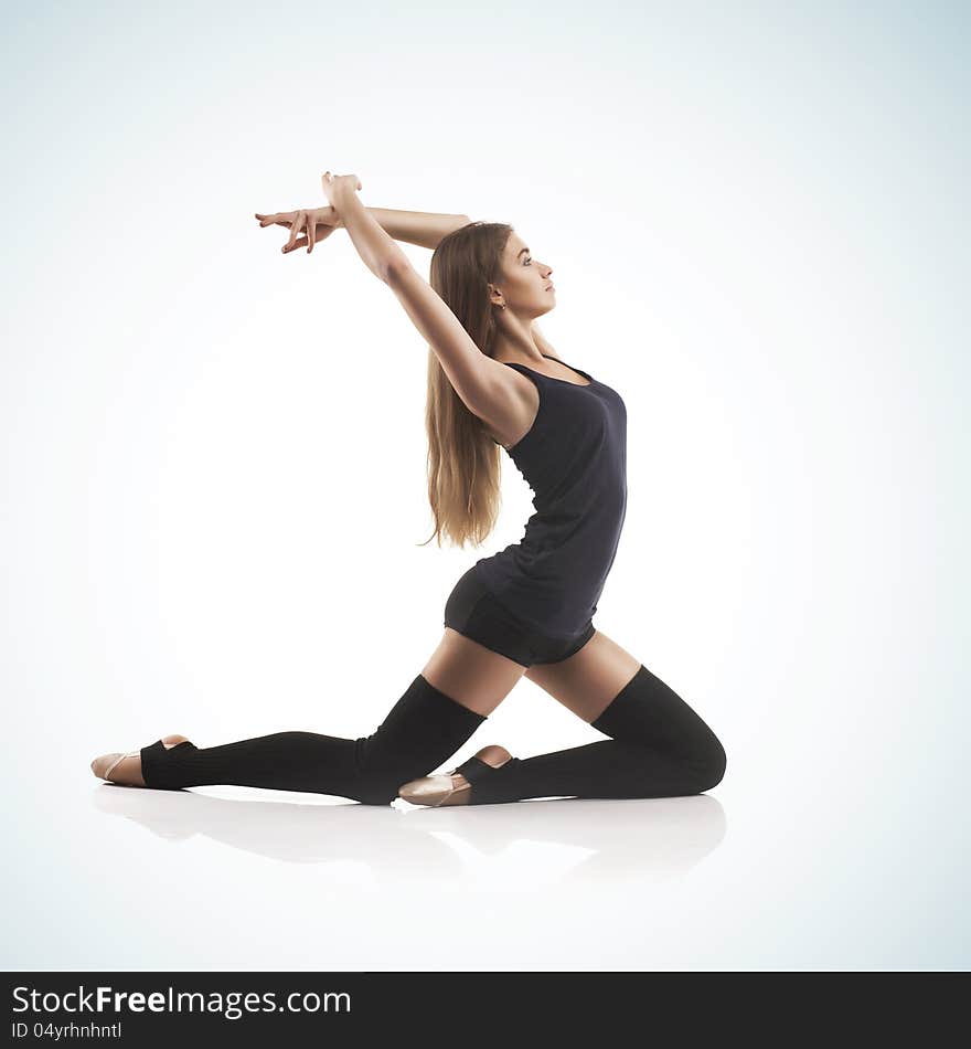 Cute woman gymnast on blue background