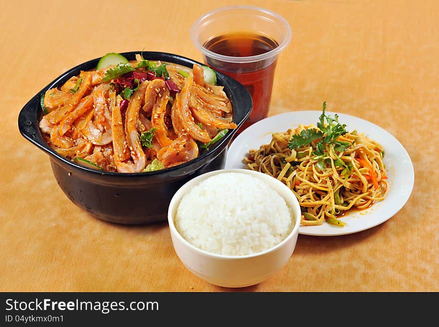 Chinese cuisine - tripe casserole and rice, with vegetables, salad and soda