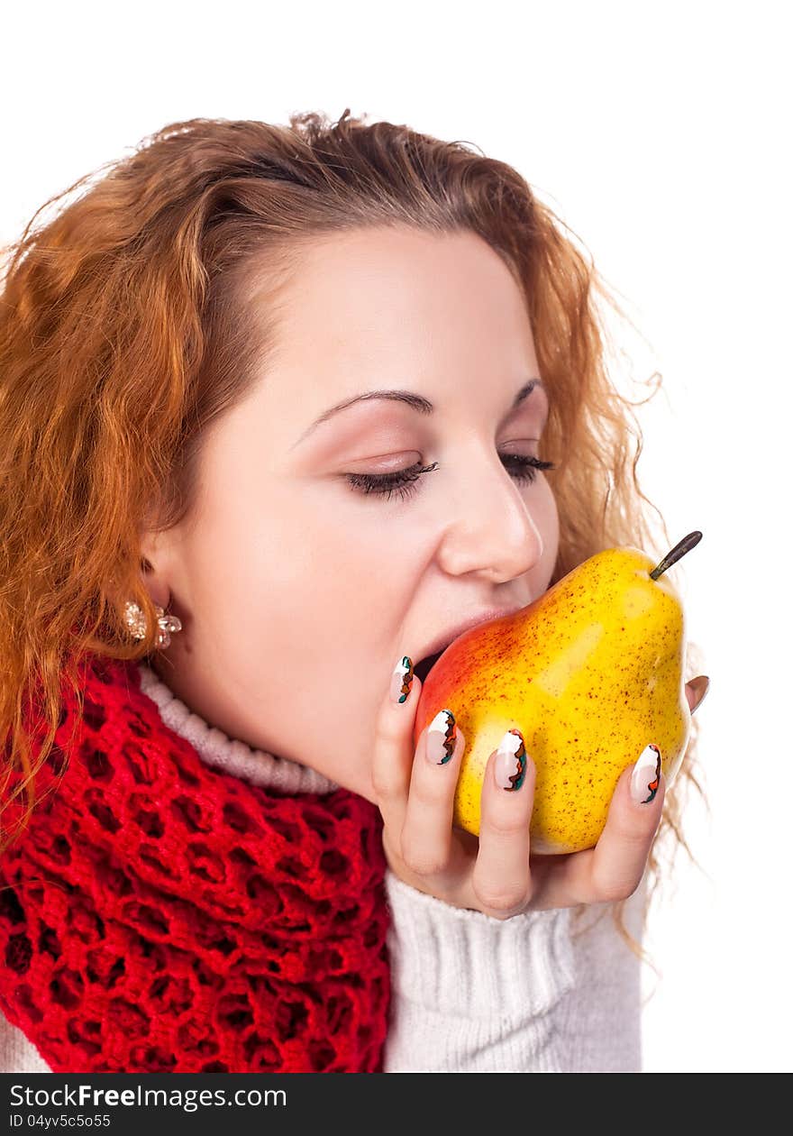 Red-haired girl want to eat a pears isolated on white. Red-haired girl want to eat a pears isolated on white