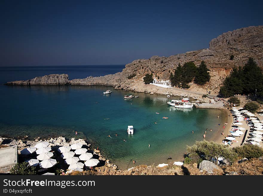 Torquois hidden bay in Rhodes Greece