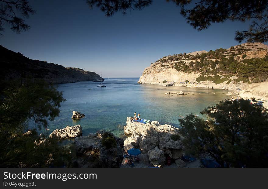 Torquois hidden bay in Rhodes Greece