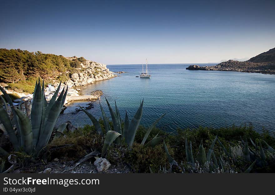 Torquois hidden bay in Rhodes Greece