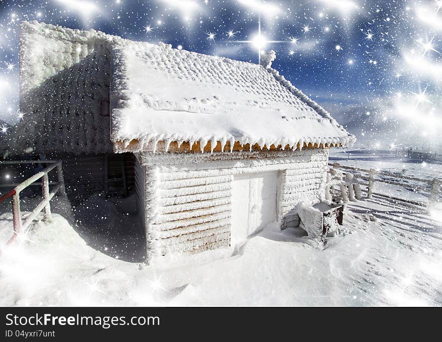 Christmas background with fairytale house in the mountains