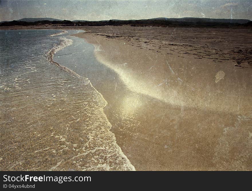 Vintage photo of long deserted beach. Vintage photo of long deserted beach