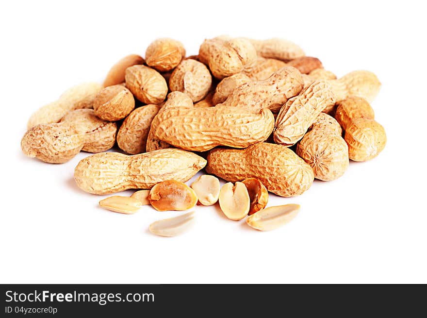 Pile of groundnuts on a white background