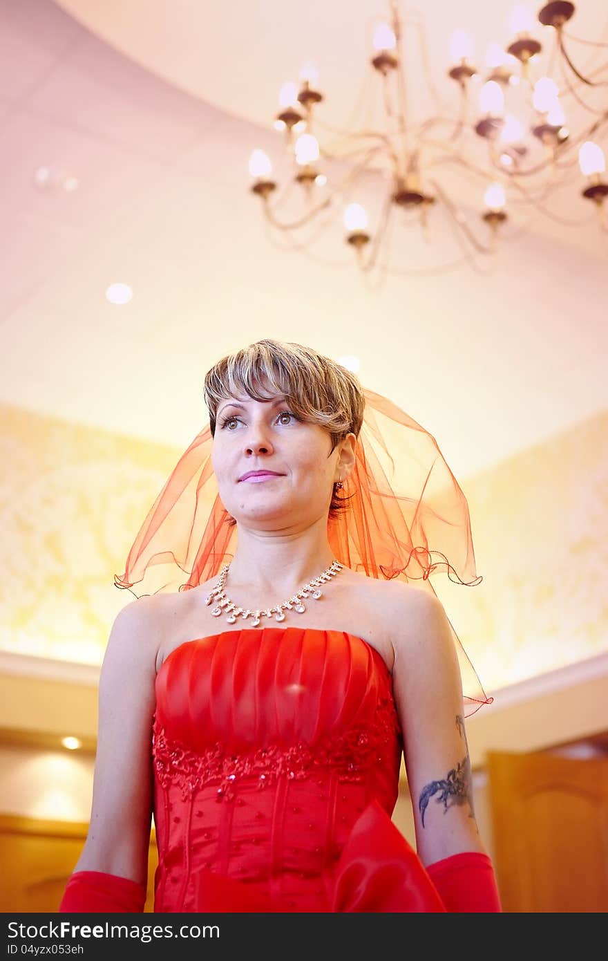 The girl bride in a red dress