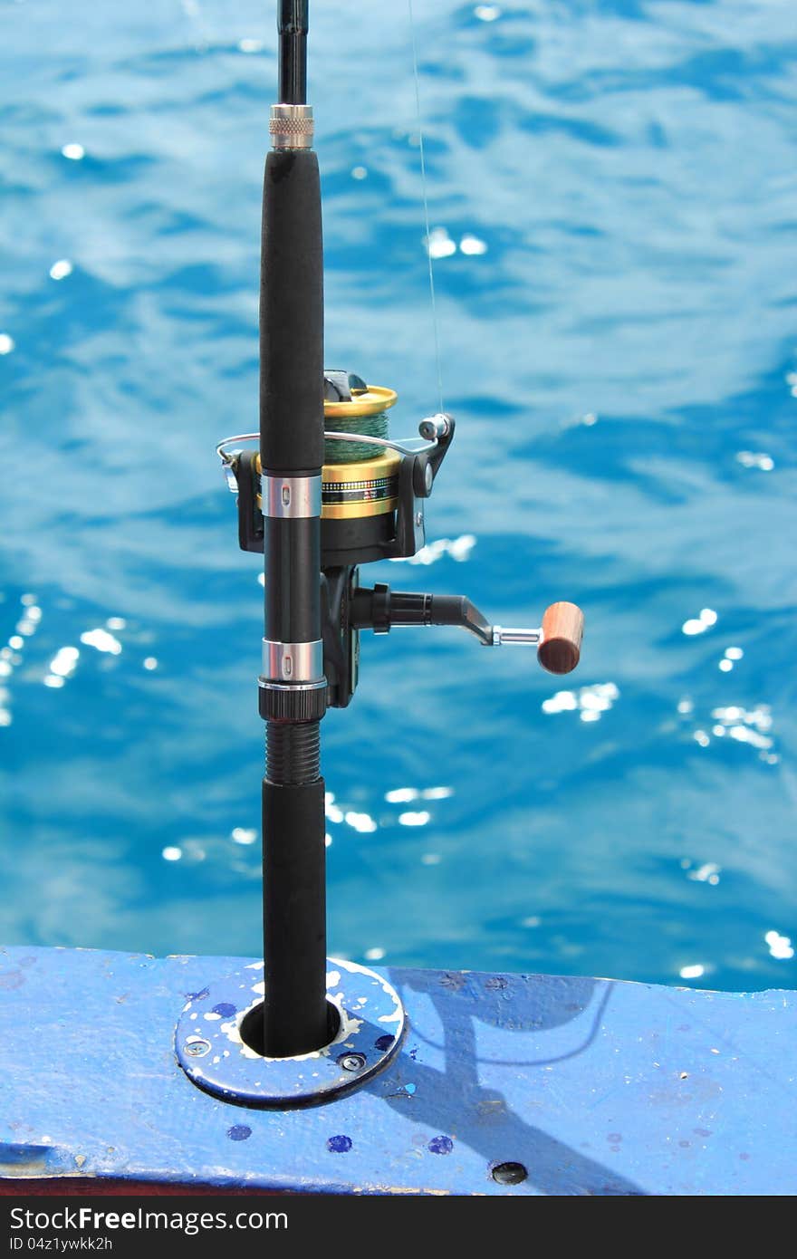 Reel and rod with blue sea