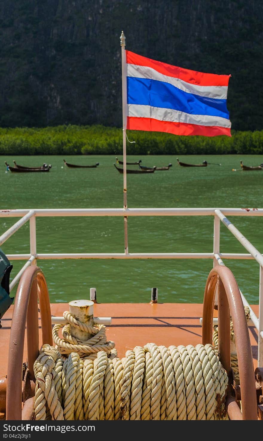 Thai nation flag is on a escort boat