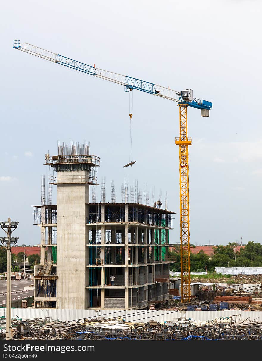 Building crane and building in construction site