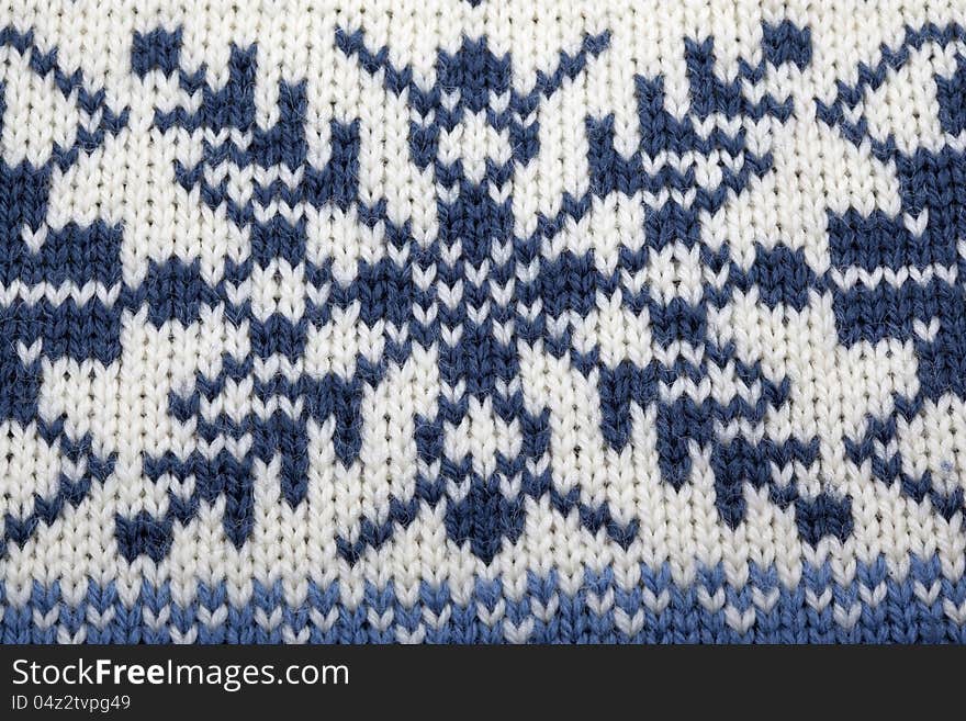 Knitted material with Nordic pattern for use as background. Knitted material with Nordic pattern for use as background