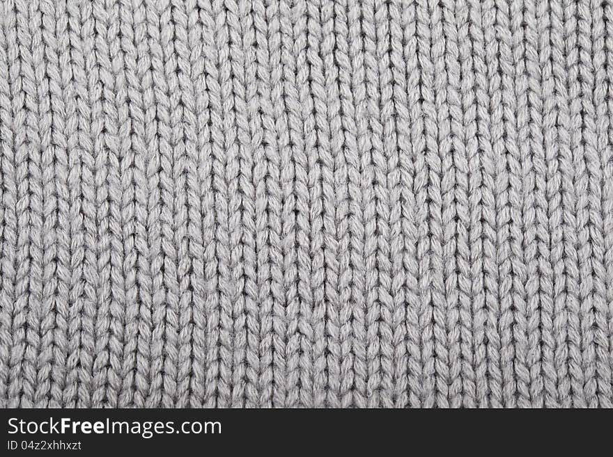 Gray knitted material for use as a background. Gray knitted material for use as a background